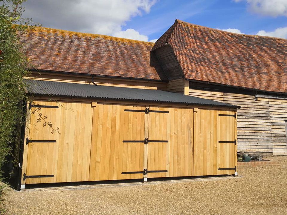 Oak clad garage Lyons Build Ltd